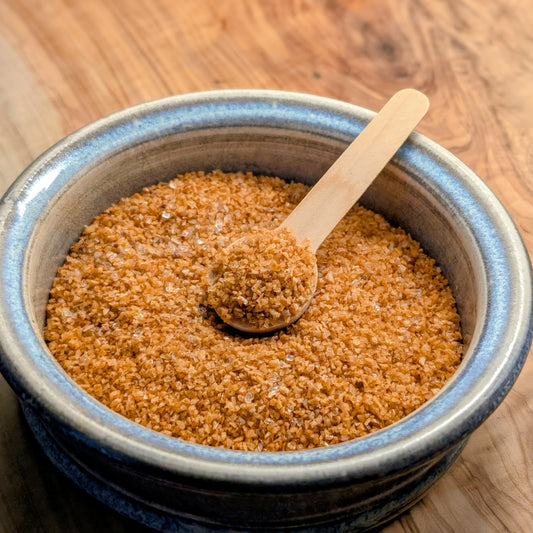 Phantom Sea Salt in bowl with small wooden spoon