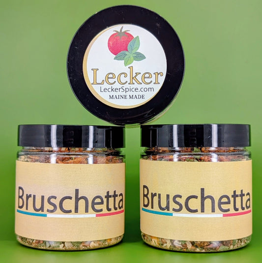 Three jars of Lecker Spice Bruschetta seasoning on a green background